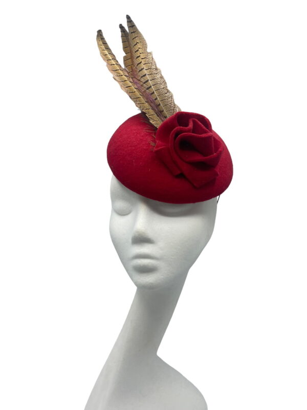 Stunning cherry red felt headpiece with feather detail.